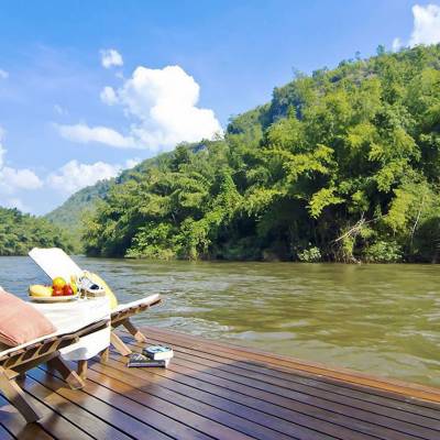 a wooden bench sitting next to a body of water