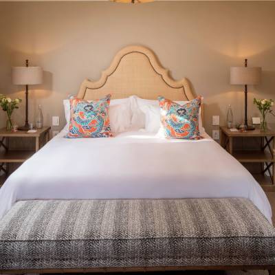 a bedroom with a large bed in a room