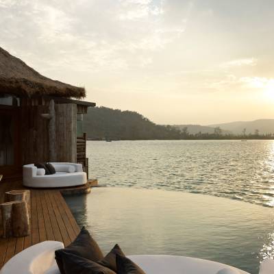 a chair sitting in front of a body of water