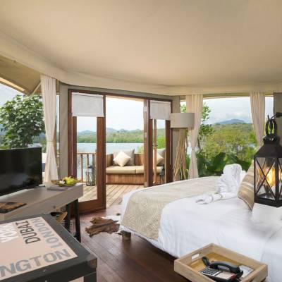 a living room filled with furniture and a large window