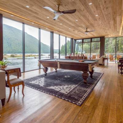 a living room filled with furniture and a large window