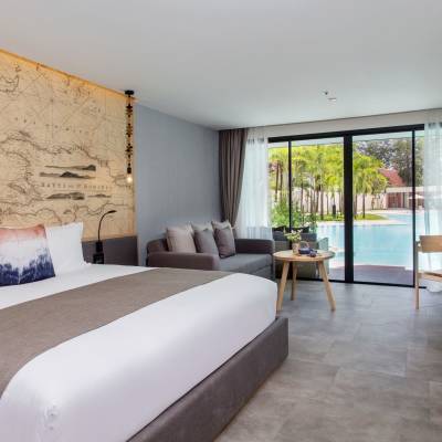 a bedroom with a large bed in a hotel room