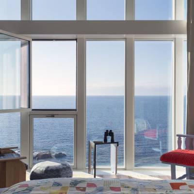 a living room filled with furniture and a large window