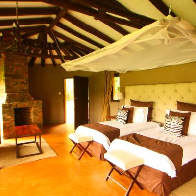 a living room filled with furniture and a bed