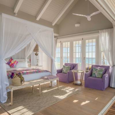 a living room filled with furniture and a large window