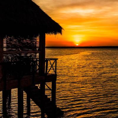 a view of a pier next to a body of water