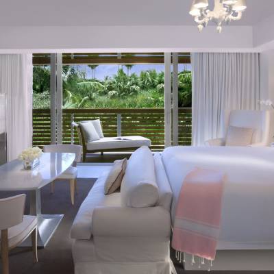 a living room filled with furniture and a large window