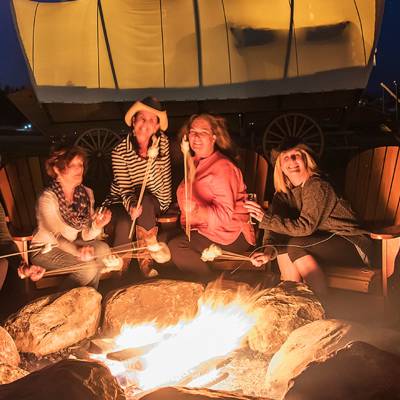 Campfire with s'mores at Conestoga Ranch Glamping Resort
