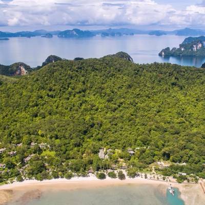 a body of water with a mountain in the background