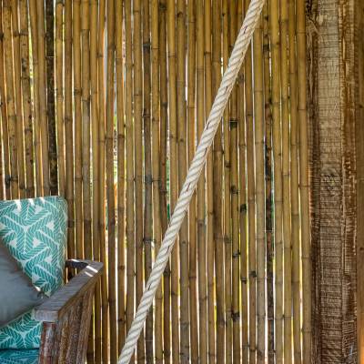 a chair sitting in front of a fence