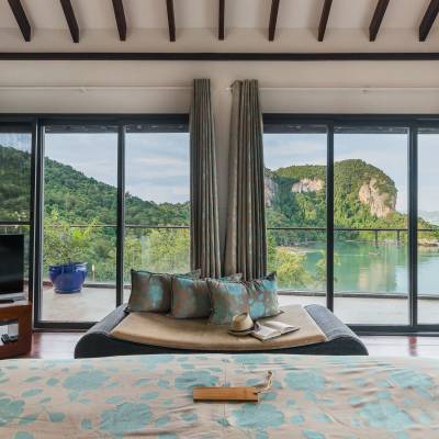 a view of a living room filled with furniture and a large window