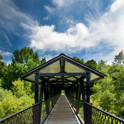 a bridge over a metal fence
