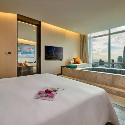 a bedroom with a large bed in a hotel room