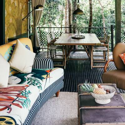 a living room filled with furniture and a window