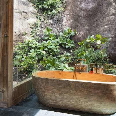 a wooden bench in a garden