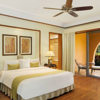a bedroom with a large bed in a hotel room