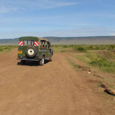 a truck traveling down a dirt road