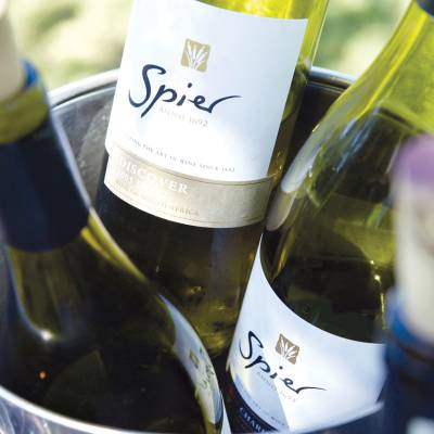a close up of a bottle and a glass of wine