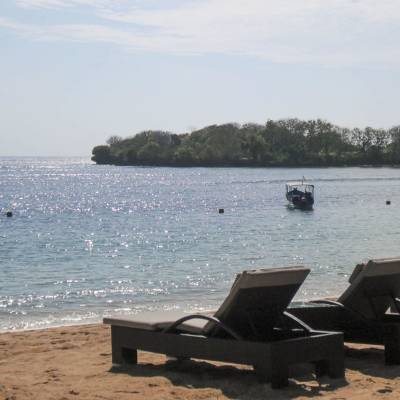 a boat sitting on top of a beach