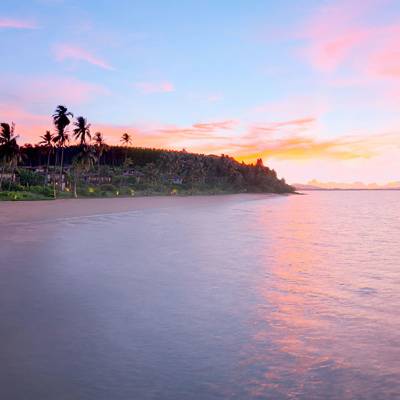 a sunset over a body of water