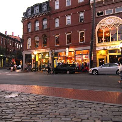 a city street in front of a brick building
