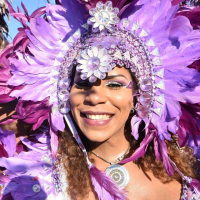 a person wearing a purple flower