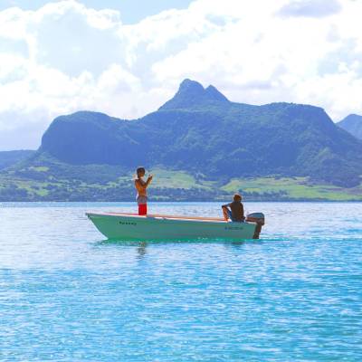 Speedboat in Mauritius with the island in the background