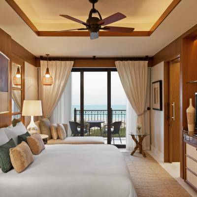a bedroom with a large bed in a room