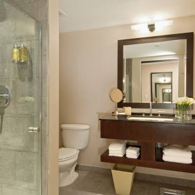 a room with a sink and a mirror
