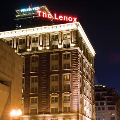 a tall building lit up at night