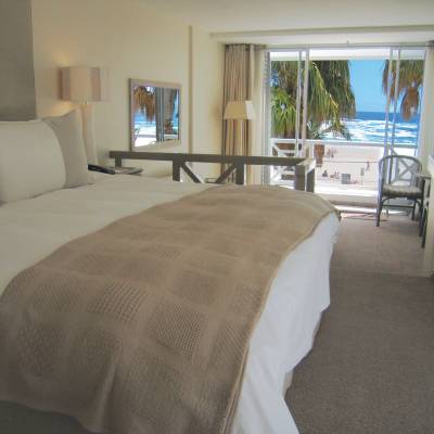a bedroom with a large bed in a hotel room