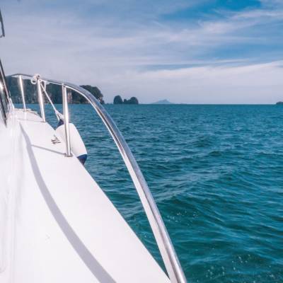 a close up of a boat next to a body of water