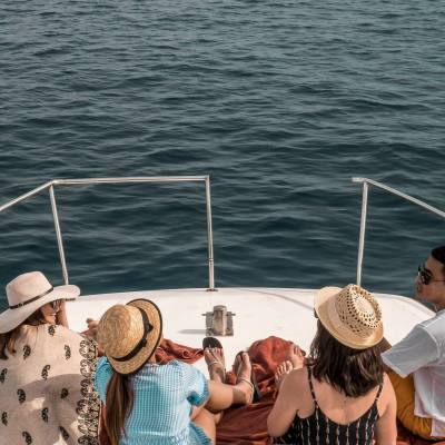 a group of people in a boat on a body of water