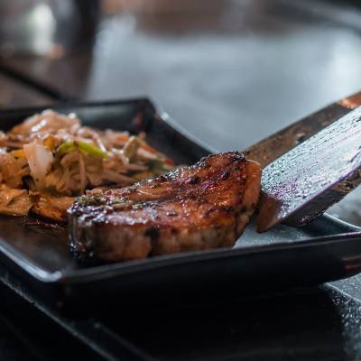 a tray of food with a knife and fork