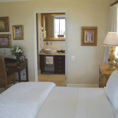 a bedroom with a bed in a room