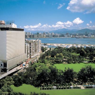 a large body of water with a city in the background