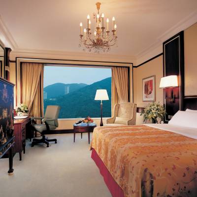 a bedroom with a large bed in a hotel room