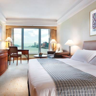 a bedroom with a large bed in a hotel room