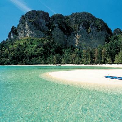 a blue frisbee with Railay Beach in the background