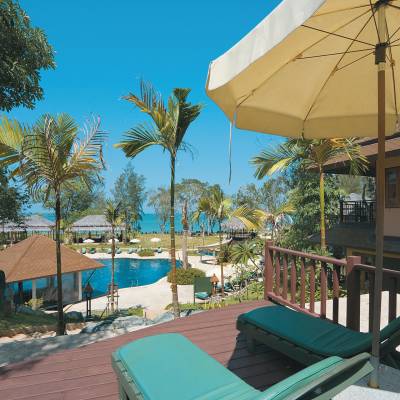 an umbrella sitting on top of a wooden fence