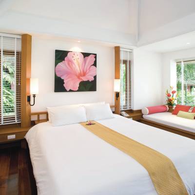a bedroom with a bed and window in a room