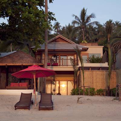 a wooden bench in front of a house