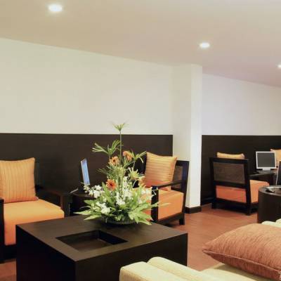 a living room filled with furniture and a flat screen tv