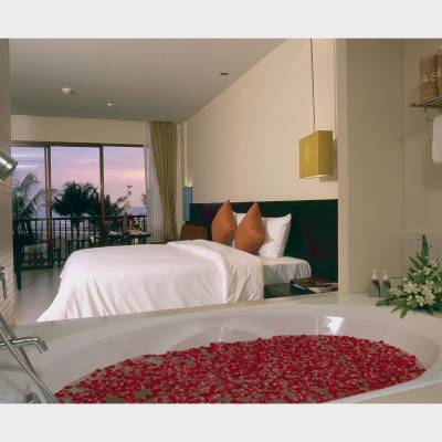 a bedroom with a large bed in a room