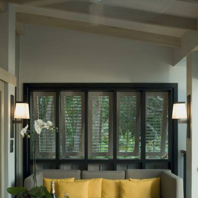 a living room filled with furniture and a large window