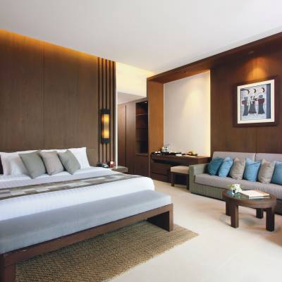 a bedroom with a large bed in a hotel room