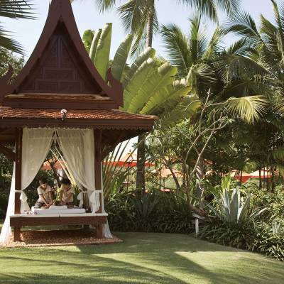 a tree in front of a house