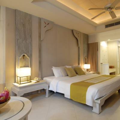 a bedroom with a large mirror