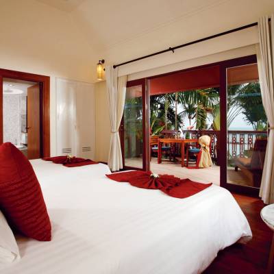a bedroom with a large bed in a hotel room