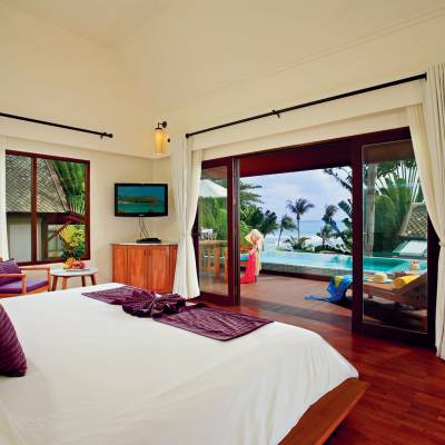 a bedroom with a large bed in a room